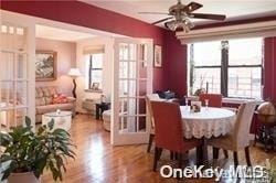 dining room featuring ceiling fan and parquet flooring