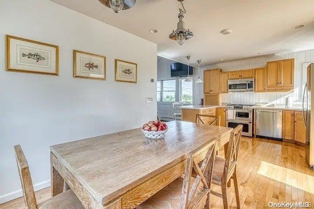 dining room with light wood-type flooring