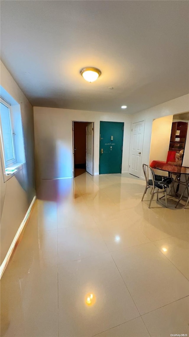 corridor with tile patterned flooring