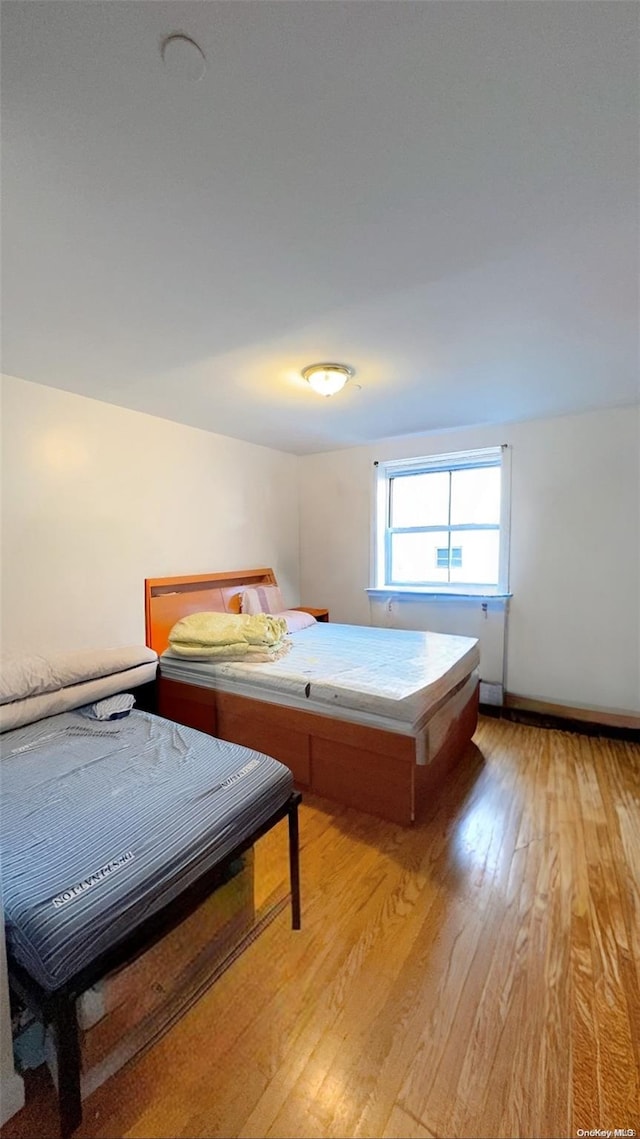 bedroom with light wood-type flooring