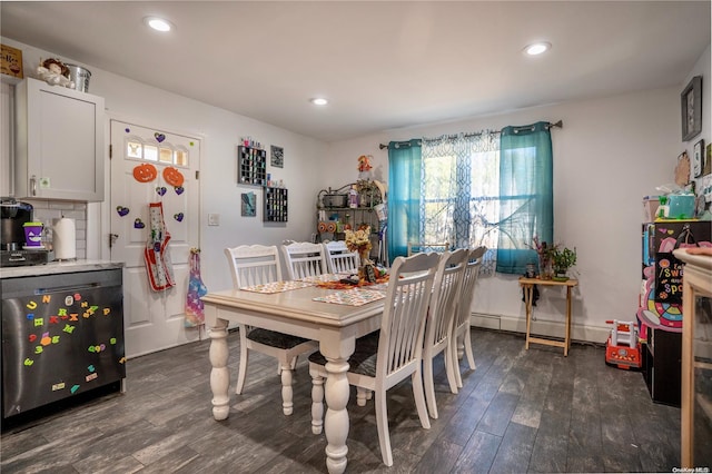 dining area with baseboard heating and dark wood-type flooring