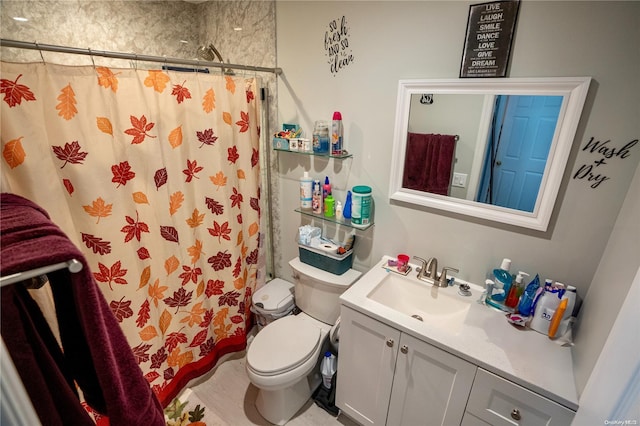 bathroom featuring walk in shower, vanity, and toilet