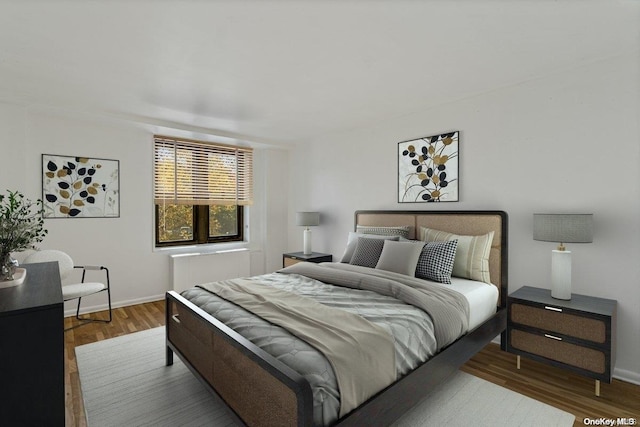 bedroom with dark wood-type flooring