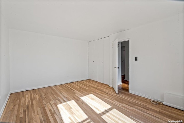 spare room featuring light hardwood / wood-style floors