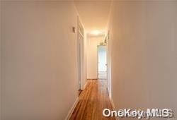 hallway with light hardwood / wood-style flooring