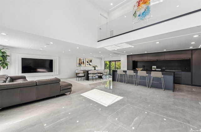 living room with a high ceiling