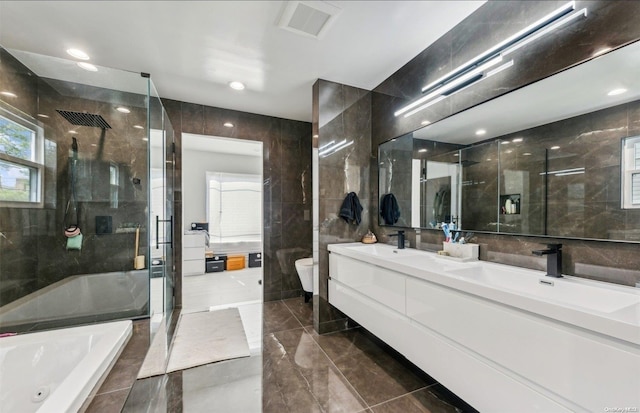 full bathroom featuring plus walk in shower, vanity, toilet, and tile walls