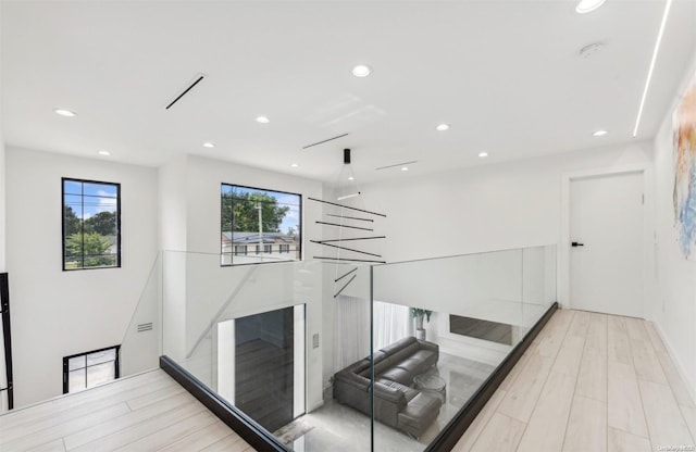 stairs featuring hardwood / wood-style flooring