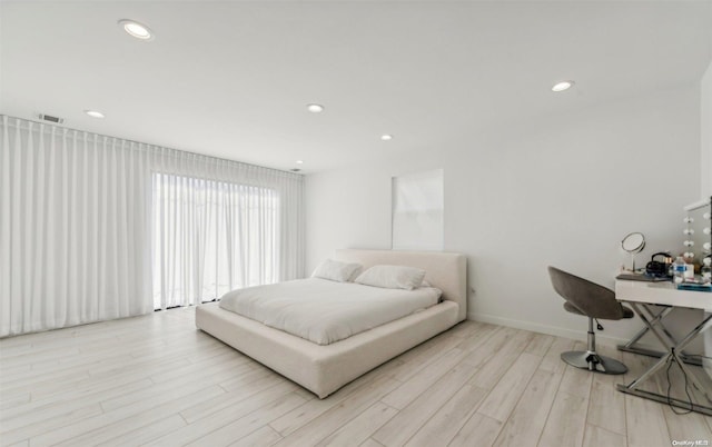 bedroom with light hardwood / wood-style flooring