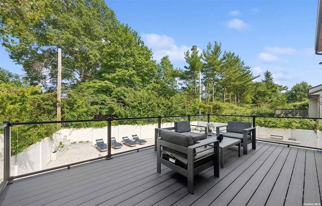 deck featuring outdoor lounge area