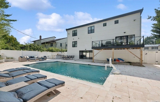 view of pool with outdoor lounge area and a patio area