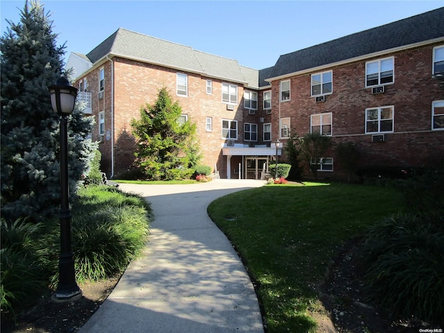 view of community featuring a yard