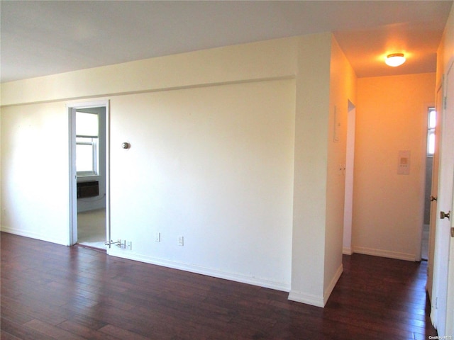 empty room with dark hardwood / wood-style floors