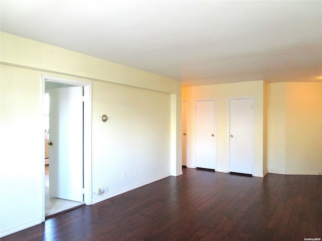 spare room featuring dark hardwood / wood-style flooring