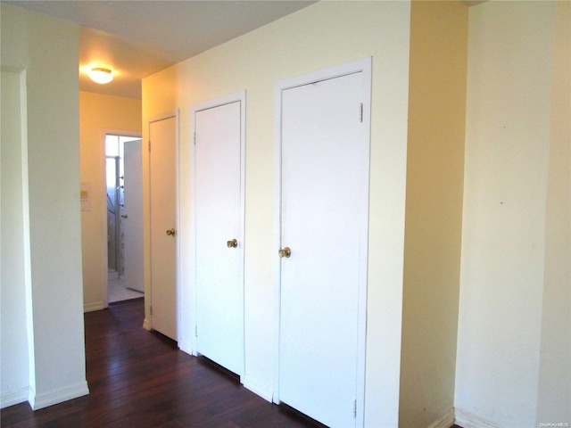 corridor featuring dark hardwood / wood-style flooring