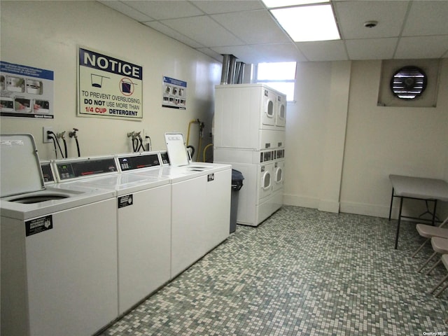 washroom featuring washing machine and dryer and stacked washing maching and dryer