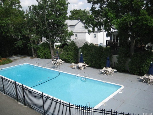 view of swimming pool with a patio