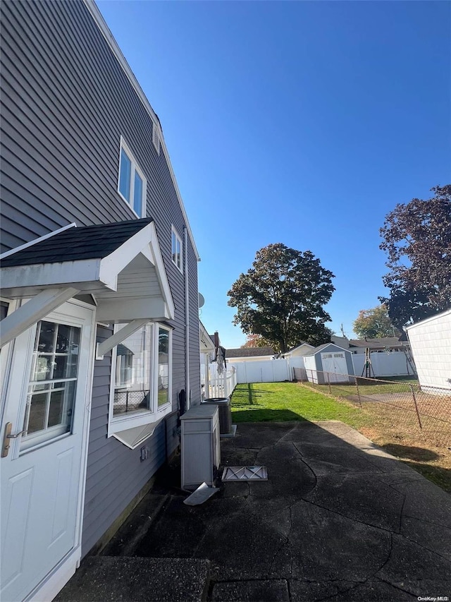 view of home's exterior with a lawn