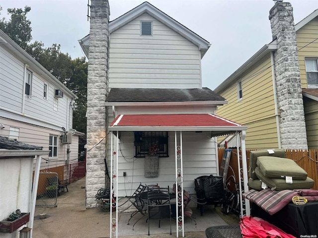 rear view of house with a patio