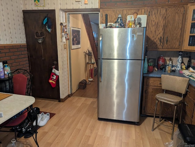 kitchen featuring light hardwood / wood-style floors and stainless steel refrigerator