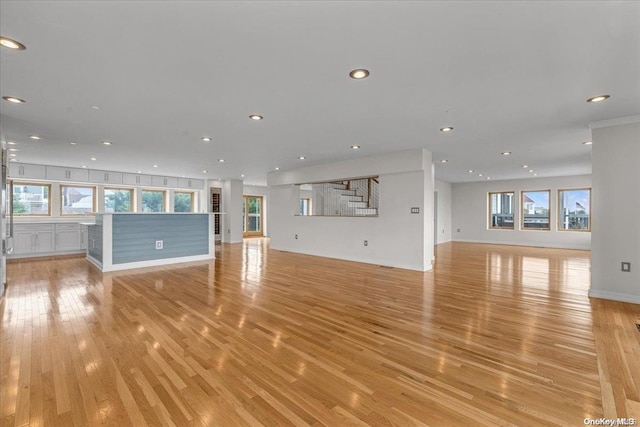 unfurnished living room with light hardwood / wood-style floors