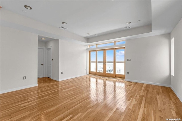 spare room featuring light wood-type flooring