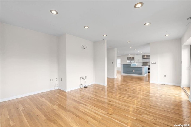 unfurnished living room with light hardwood / wood-style floors