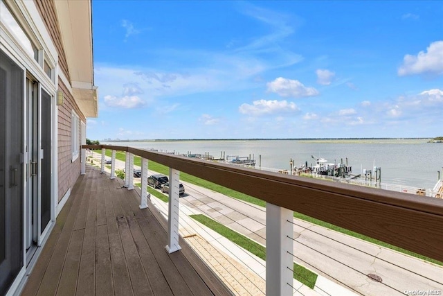 wooden deck featuring a water view