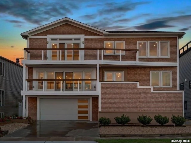 exterior space featuring a balcony and a garage