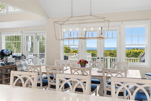 sunroom featuring a wealth of natural light, french doors, and vaulted ceiling