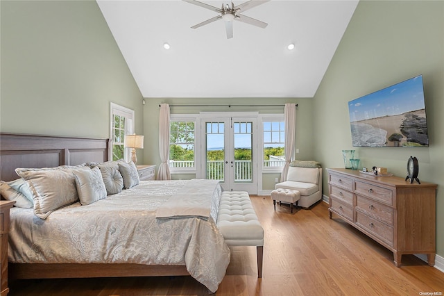 bedroom featuring french doors, light wood-type flooring, access to outside, ceiling fan, and high vaulted ceiling