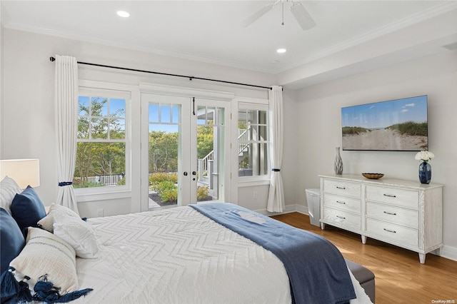 bedroom with french doors, ornamental molding, access to outside, ceiling fan, and wood-type flooring