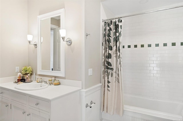 bathroom featuring vanity and shower / bath combo with shower curtain