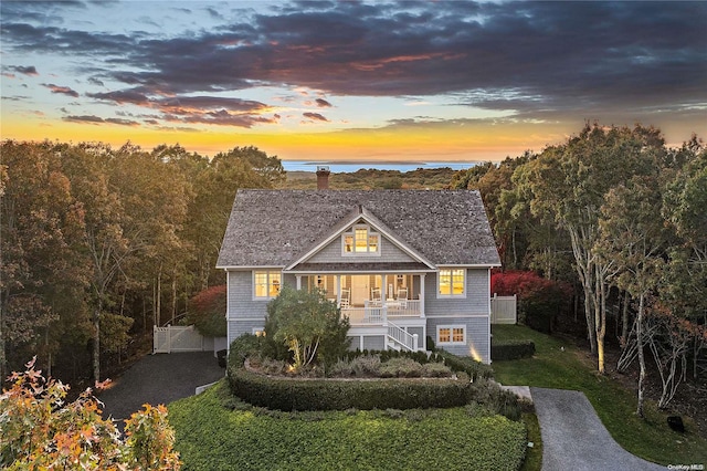 view of front of home with a lawn and covered porch