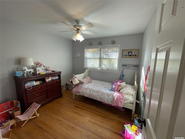 bedroom featuring ceiling fan and light wood-type flooring