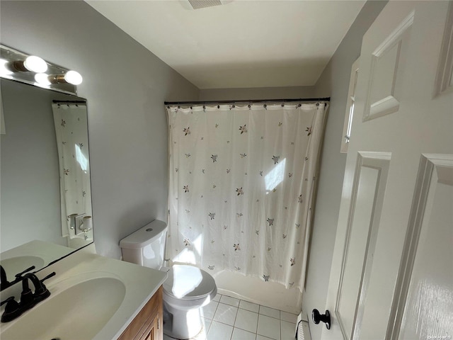 full bathroom featuring tile patterned floors, vanity, shower / tub combo, and toilet