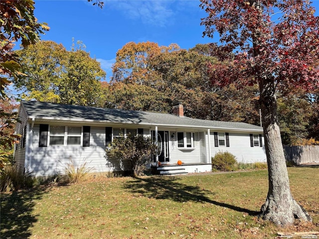 ranch-style home with a front yard