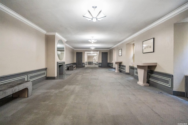 unfurnished living room with carpet and ornamental molding