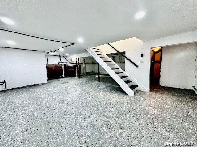 basement featuring a textured ceiling