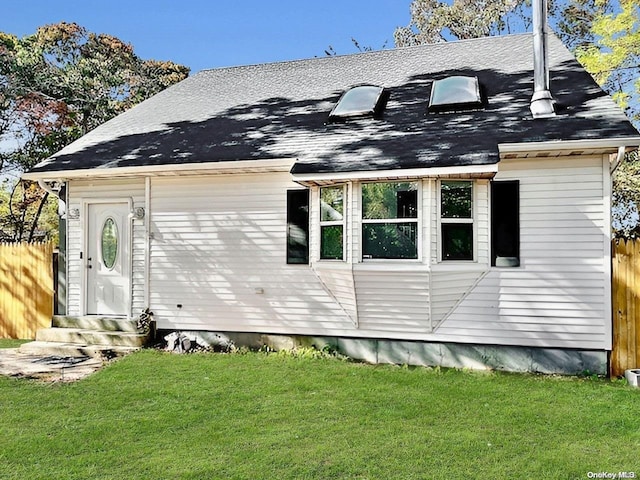 view of home's exterior featuring a lawn