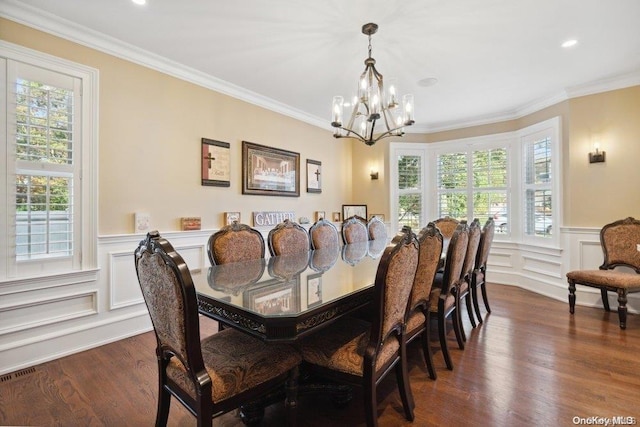 dining room featuring a notable chandelier, crown molding, and dark wood-type flooring