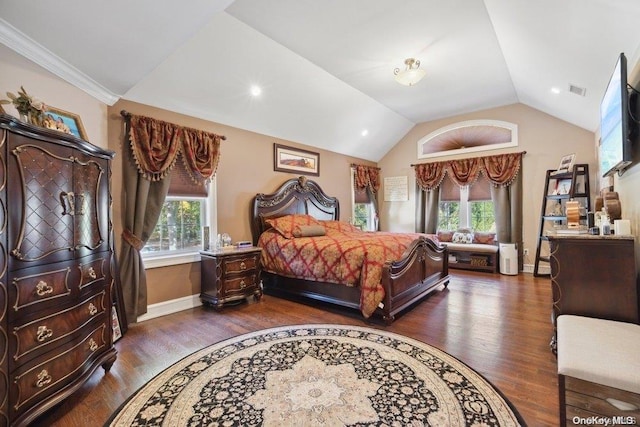 bedroom with dark hardwood / wood-style flooring, vaulted ceiling, and ornamental molding