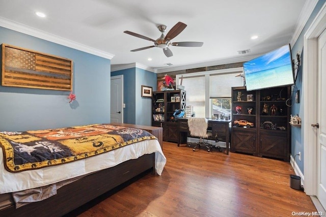 bedroom with hardwood / wood-style floors, ceiling fan, and ornamental molding