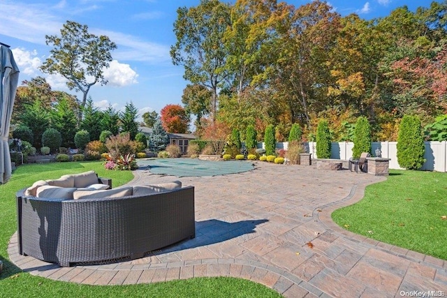 view of patio / terrace featuring an outdoor hangout area and a covered pool