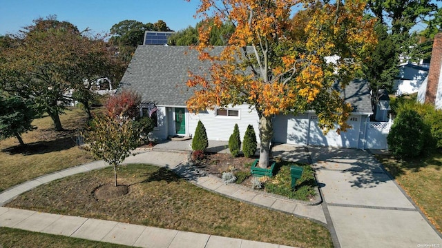 obstructed view of property featuring a front lawn