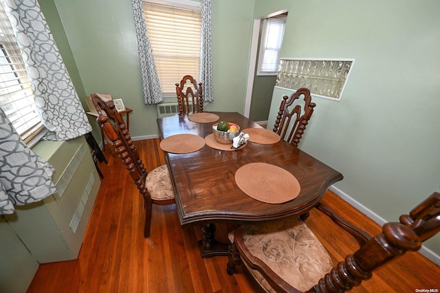 dining area with dark hardwood / wood-style floors