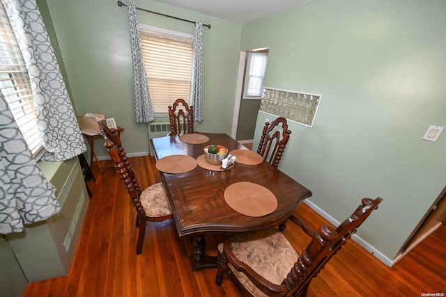 dining space featuring dark hardwood / wood-style floors