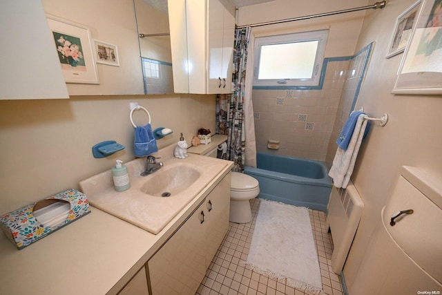 full bathroom with tile patterned flooring, shower / tub combo with curtain, vanity, and toilet