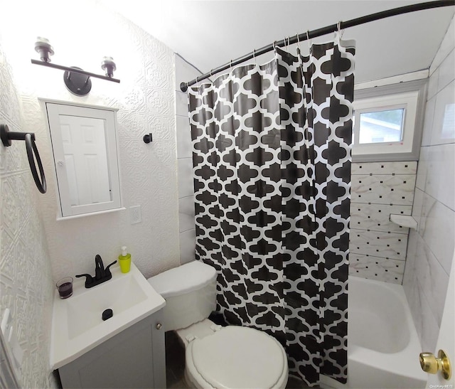 full bathroom with vanity, toilet, and shower / bath combo with shower curtain