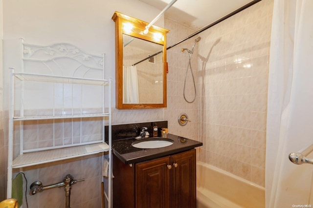 bathroom with vanity and shower / bath combination with curtain